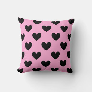 Black polka hearts on cotton candy pink cushion