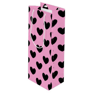 Black polka hearts on cotton candy pink wine gift bag