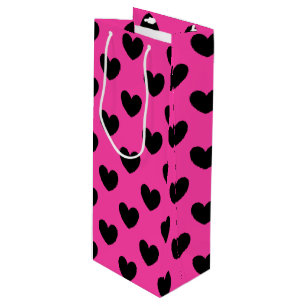 Black polka hearts on fuchsia pink wine gift bag