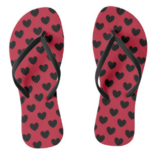 Black polka hearts on red thongs