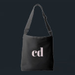 Black rose gold initials monogram elegant modern crossbody bag<br><div class="desc">A classic chic black background. Personalise and add your monogram initials written with girly and feminine rose gold coloured block letters. Modern,  trendy and simple.</div>