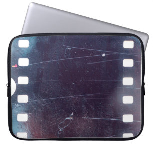 black scratched 35mm film frame, emulsion texture laptop sleeve