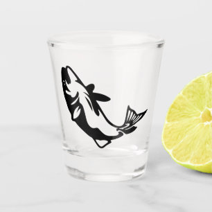 Black silhouette drawing on shot glass