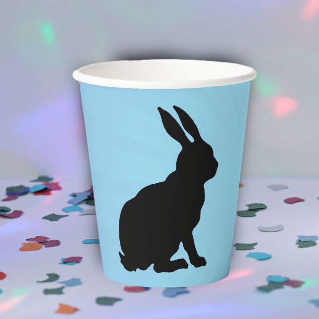Black Silhouette Sitting Bunny Tall Ears on Blue Paper Cups (Sitting black silhouette bunny rabbit on blue paper party drinking cup.)