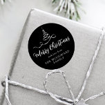 Black Silver Ribbon Tree Merry Christmas Script Classic Round Sticker<br><div class="desc">This modern holiday sticker features a silver faux foil ribbon Christmas tree and the words "Merry Christmas" in stylish silver grey calligraphy script on a black background. Personalise it with your family's name in serif font.</div>