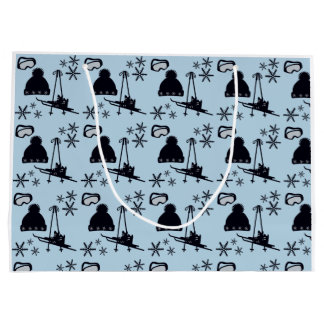 Black ski equipment & snowflakes on blue large gift bag