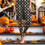 Black Skull and Flowers Floral Halloween Leggings<br><div class="desc">These spooky yet stylish leggings feature a black background with skulls and flowers, perfect for adding a unique Halloween touch to your outfit. The floral design brings an elegant twist to the classic skull motif, making these leggings a great choice for any Halloween-themed event or casual wear during the fall...</div>