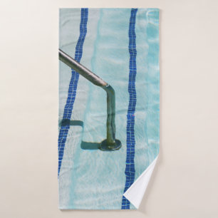 Black strap on blue swimming pool bath towel