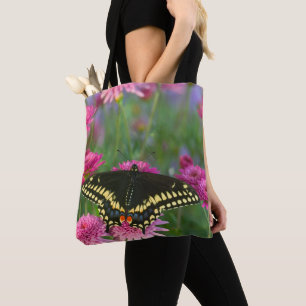 Black Swallowtail Butterfly on Dark Pink Flower Tote Bag