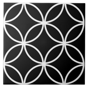 Black tile, white repeating circle leaf pattern ceramic tile