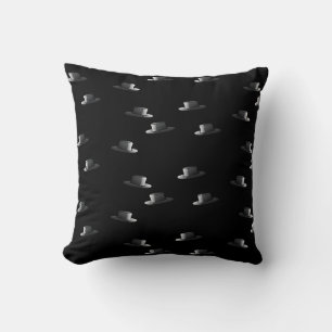 Black top hat on black cushion