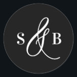 Black Whimsical Calligraphy Wedding Monogram Classic Round Sticker<br><div class="desc">Add a charming finishing touch to your wedding stationery or favours with this wedding sticker featuring a whimsical calligraphy ampersand. Designed with a romantic yet modern flair, this sticker is perfect for sealing envelopes, decorating favour boxes, or adding a personalised detail to welcome bags and more. The hand-drawn ampersand adds...</div>