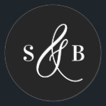 Black Whimsical Calligraphy Wedding Monogram Classic Round Sticker<br><div class="desc">Add a charming finishing touch to your wedding stationery or favours with this wedding sticker featuring a whimsical calligraphy ampersand. Designed with a romantic yet modern flair, this sticker is perfect for sealing envelopes, decorating favour boxes, or adding a personalised detail to welcome bags and more. The hand-drawn ampersand adds...</div>