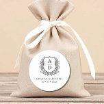 Black White Crest Modern Monogram Wedding  Classic Round Sticker<br><div class="desc">Add a touch of timeless elegance to your wedding with these Black White Crest Modern Monogram Wedding Classic Round Stickers. Featuring a crisp black and white design, a refined crest emblem, and a personalised monogram, these stickers are perfect for sealing envelopes, decorating favours, or enhancing your wedding stationery. Their minimalist...</div>