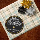 Black White Gold Merry Christmas Classic Round Sticker<br><div class="desc">Make this holiday season extra special with our Black White Gold Merry Christmas stickers. Whether you're embellishing your homemade gifts or sprucing up your holiday cards, these stickers are the perfect finishing touch. The sophisticated colour palette of black, white, and gold adds a touch of luxury to your Christmas festivities....</div>