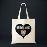 Black & White Gothic Wedding with Skull Bridesmaid Tote Bag<br><div class="desc">Designed for a Gothic wedding this bridesmaid tote bag begins with a large black heart and the word bridesmaid written in large white letters. A sugar skull is below. It has a large red flower in the centre of its forehead.</div>
