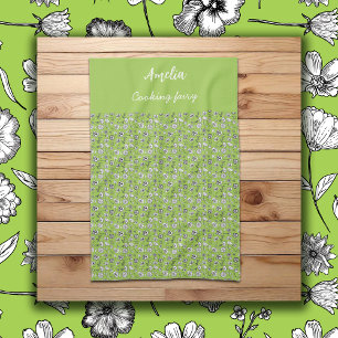 Black & white hand drawn flowers on green pattern tea towel