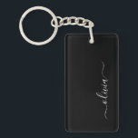 Black White Modern Minimalist Elegant Monogram Key Ring<br><div class="desc">Introducing our Black and White Minimalist Modern Monogram Collection: Embrace simplicity and sophistication with our minimalist designs, curated to elevate your style effortlessly. Crafted with a keen eye for modern aesthetics, this collection features sleek black and white designs accentuated by personalised monograms. From chic stationery to versatile accessories, our collection...</div>