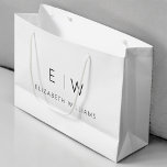 Black White Modern Minimalist Monogram Name Large Gift Bag<br><div class="desc">Present your gifts in style with our Black and White Modern Minimalist Monogram Name Gift Bag. This elegant bag boasts a clean and contemporary design, featuring a customisable monogram that adds a personalised touch to your gift-giving. Crafted with quality in mind, this bag is both sophisticated and minimalist, making it...</div>