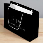 Black White Modern Minimalist Monogram Name Large Gift Bag<br><div class="desc">Present your gifts in style with our Black and White Modern Minimalist Monogram Name Gift Bag. This elegant bag boasts a clean and contemporary design, featuring a customisable monogram that adds a personalised touch to your gift-giving. Crafted with quality in mind, this bag is both sophisticated and minimalist, making it...</div>