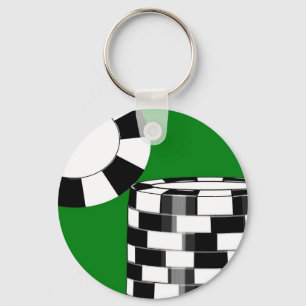 Black white poker chips on green key ring