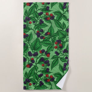 Blackberries on green beach towel