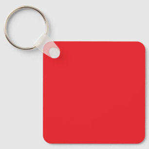 Blank Red Square Keychain Tag on Wood Surface