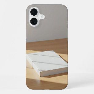 blank white hardcover on wood table iPhone 16 plus case