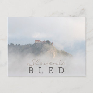 Bled castle surrounded by clouds postcard