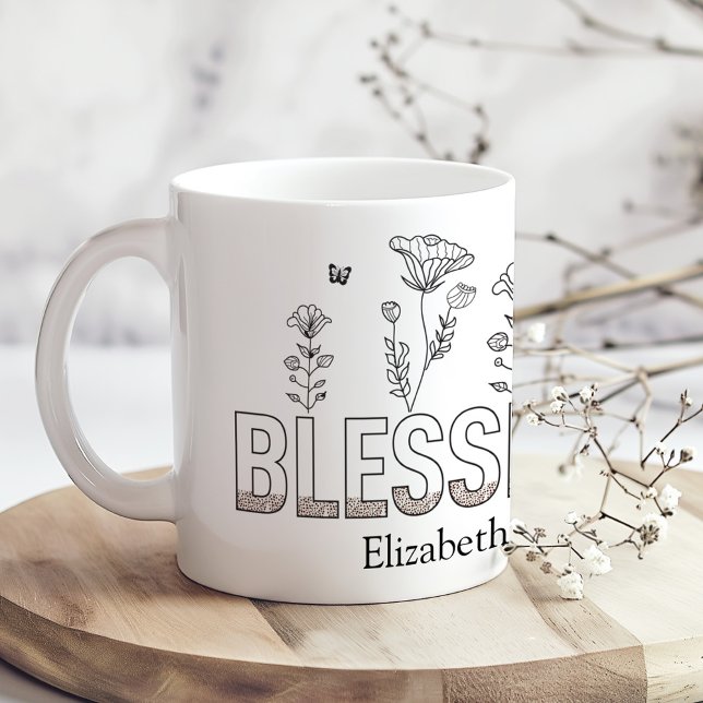 "Blessed Mama" Mother's Day Black and White Floral Coffee Mug ("Blessed Mama" Mother's Day Black and White Floral Coffee Mug on a sunny boho wooden kitchen table)