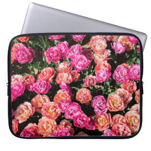 Blooming flowers make a floral background texture laptop sleeve
