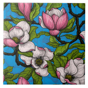Blooming magnolia on blue ceramic tile