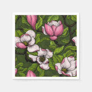 Blooming magnolia on dark green napkin