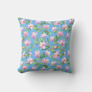 Blooming magnolia on sky blue cushion
