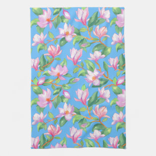 Blooming magnolia on sky blue tea towel