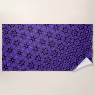 Blossoming purple star transformation beach towel