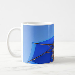 Blue and brown patio umbrella in the morning coffee mug