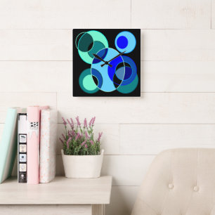 Blue and green intersecting circles design square wall clock