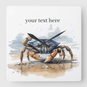 blue and orange crab walking on the beach  square wall clock