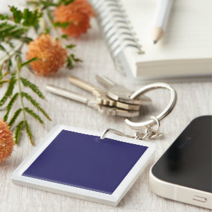 Blue and purple abstract shapes blend together in  key ring