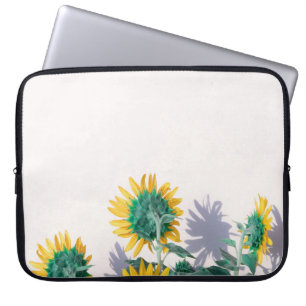 Blue and yellow flowers on white wall laptop sleeve