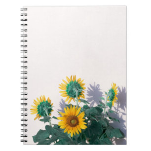 Blue and yellow flowers on white wall notebook