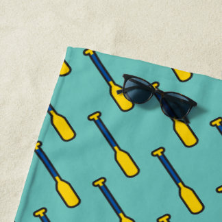 Blue And Yellow Raft Paddles on Teal Beach Towel