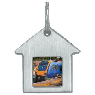 Blue and yellow train pet ID tag