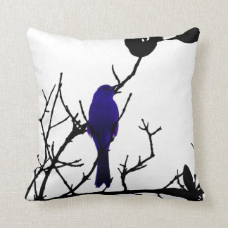 Blue bird on black tree cushion