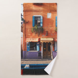 BLUE BOAT ON RIVER NEAR ORANGE BUILDING BATH TOWEL