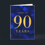 Blue Bokeh Gold Cheers to 90 Years Birthday Card<br><div class="desc">Chic 90th Birthday Greeting Card featuring the words "Cheers to 90 Years" in faux gold foil against a blue sapphire bokeh lights pattern background. To add text to the inside of the card click the "Customise" button. *Please note that the Zazzle Watermark that appears in the zoom preview will NOT...</div>