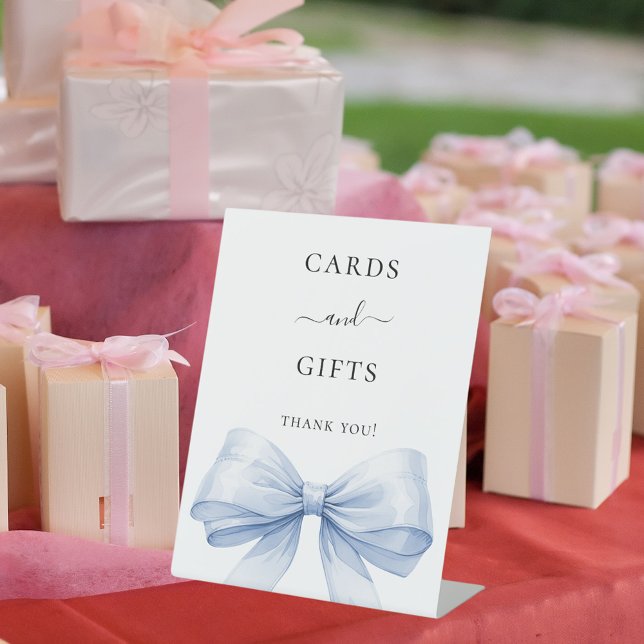 Blue bow white cards gifts sign (Creator Uploaded)