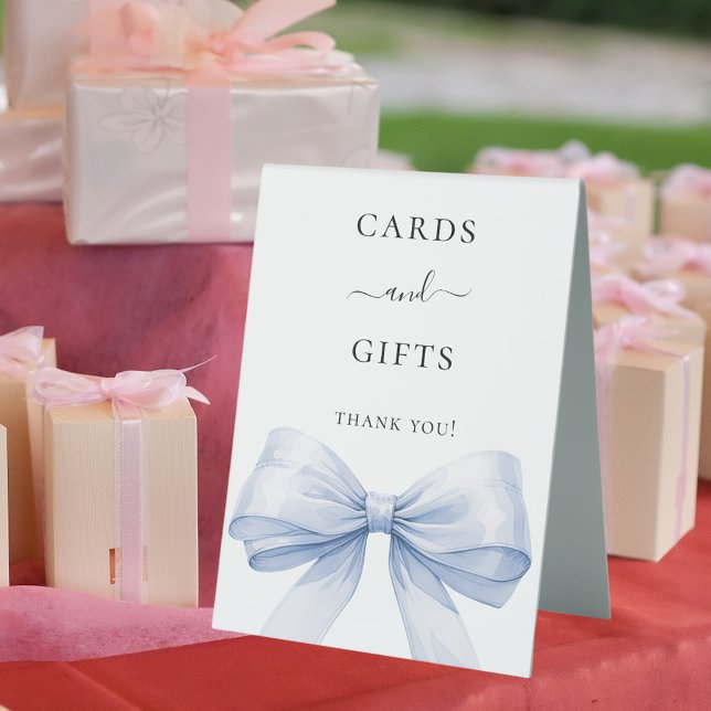 Blue bow white cards gifts sign (Creator Uploaded)