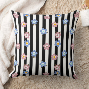 Blue brown floral pattern on black and white cushion